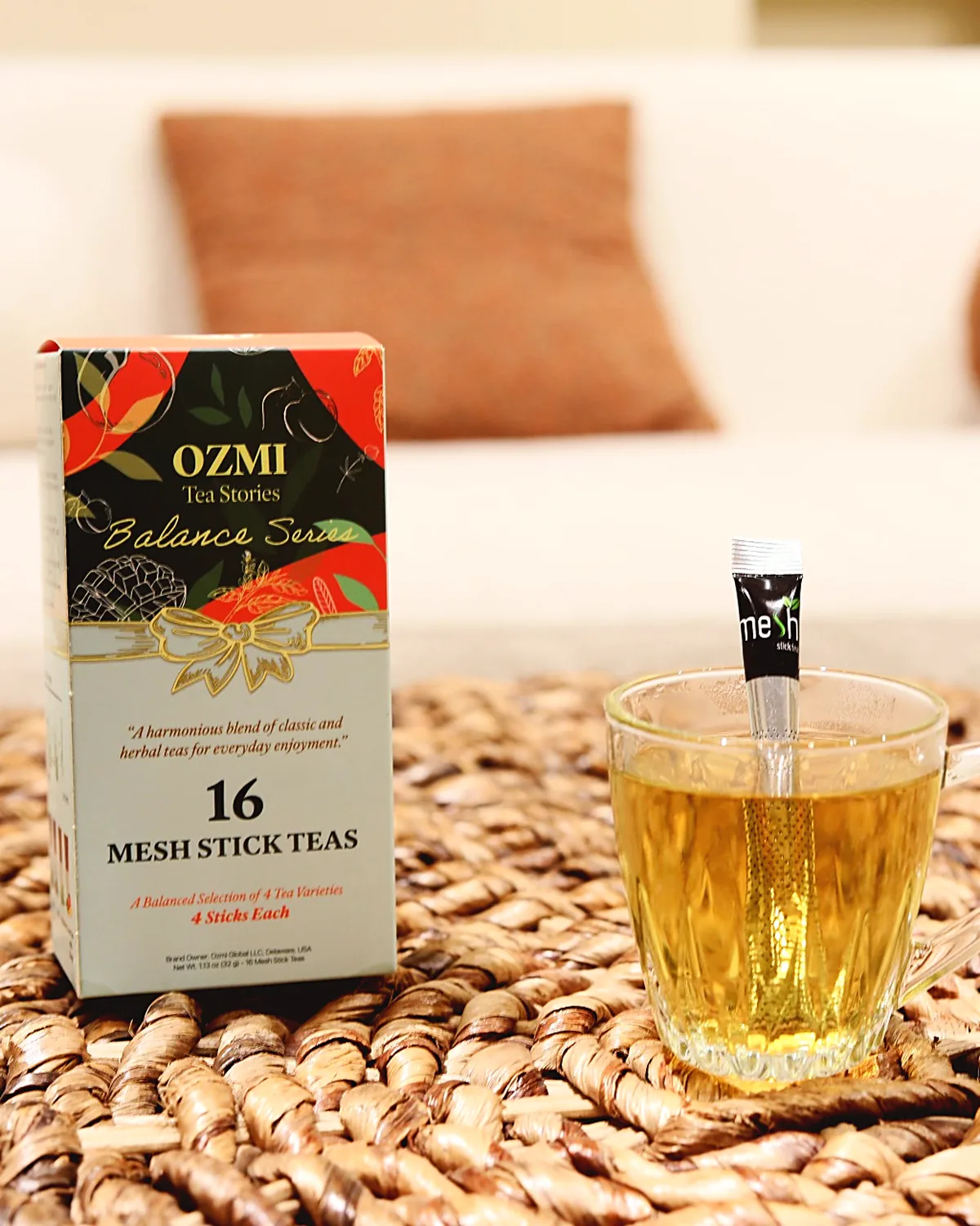 Balance Series herbal tea served in a glass cup with the OZMI box