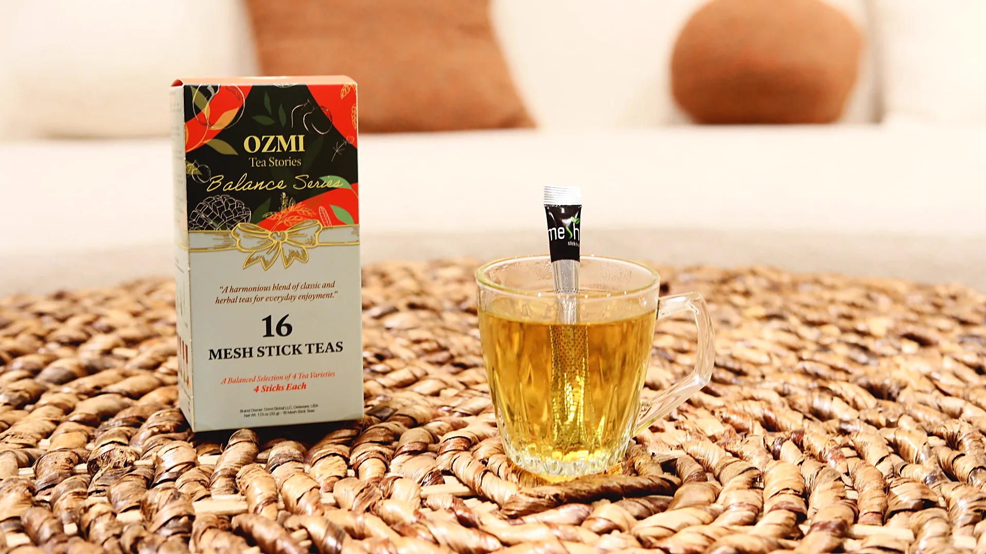 Balance Series herbal tea served in a glass cup with the OZMI box
